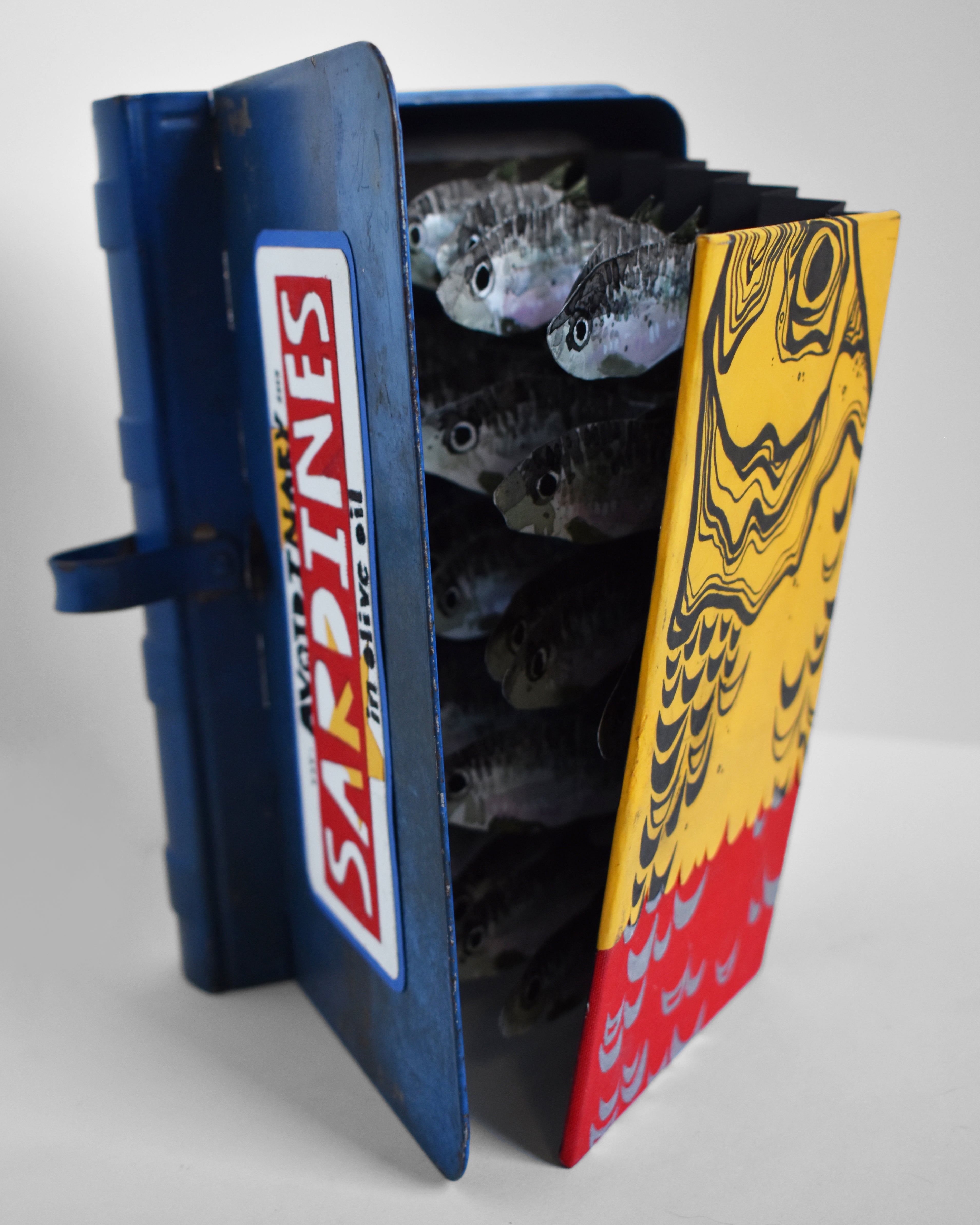 Morgan_Maxfield_Sardines-_The_Great_Escape_2023_Ink_on_paper_bound_in_a_metal_box_6in_x_1.75in_x_9in_Second_Angle_copy.jpg